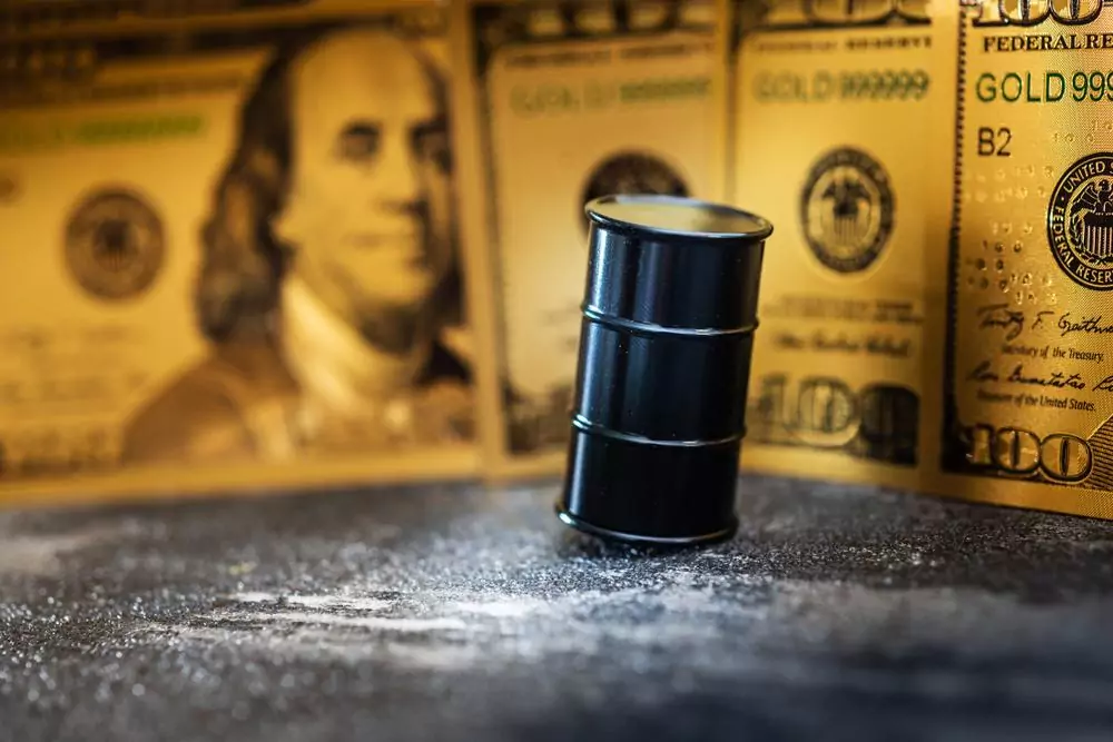Oil tanker brent crude oil price drop 83 dollars gold bars holding 4110 dollars
