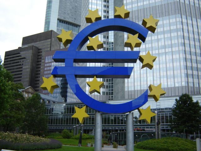 European Central Bank headquarters in Frankfurt with European flags