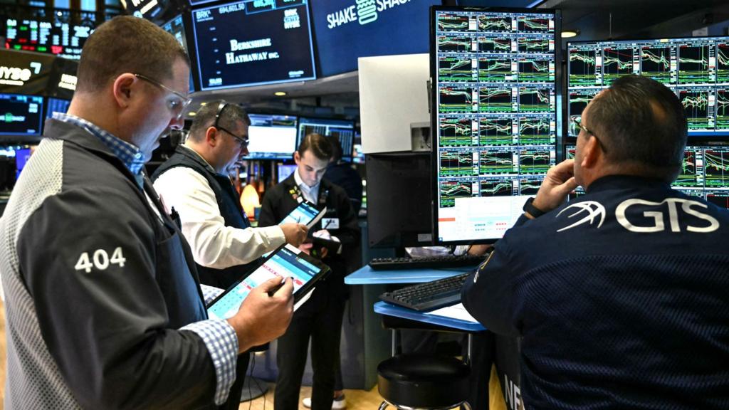 Wall Street tech stock charts showing software decline vs semiconductor chips growth