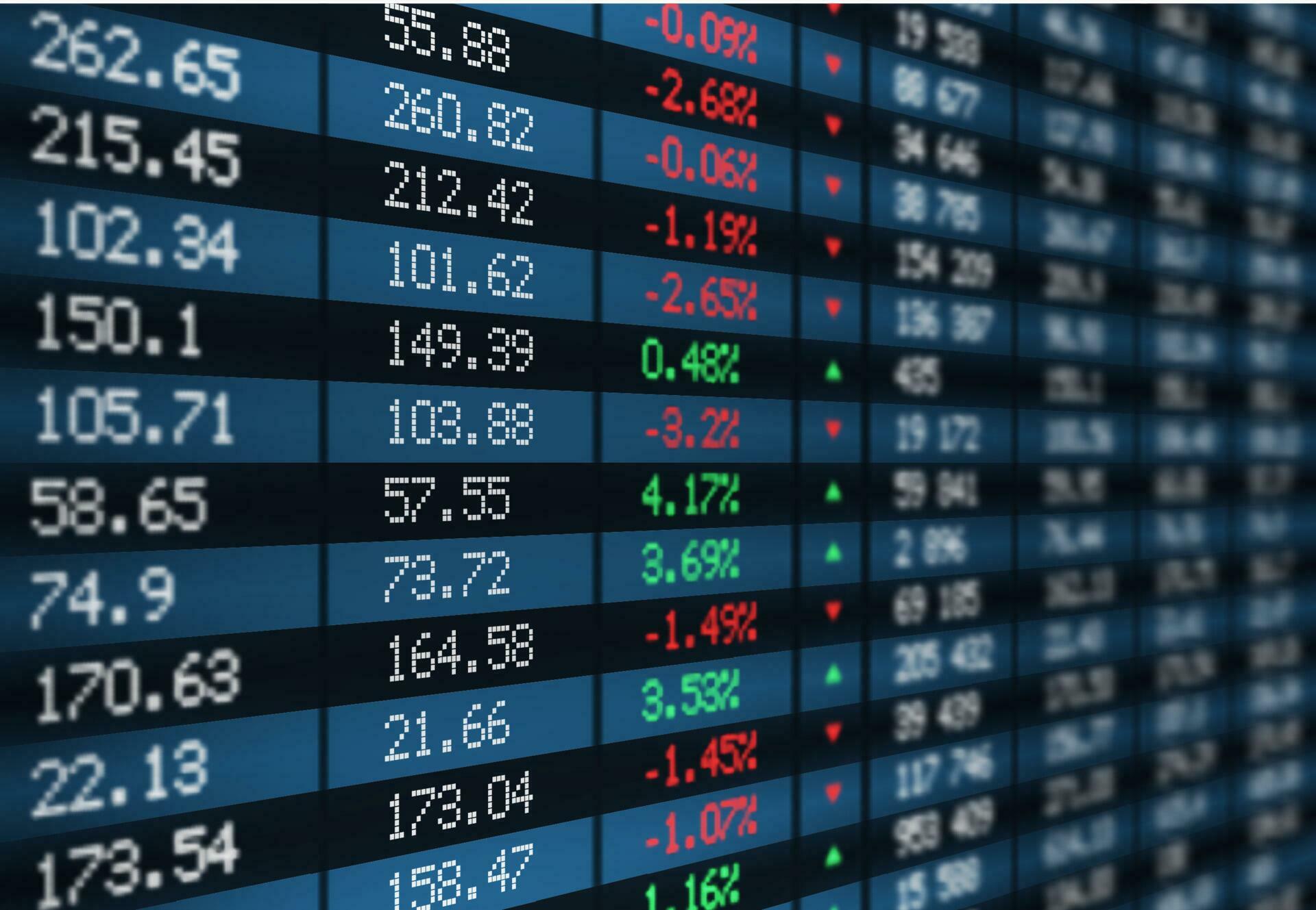 Financial stock index monitor board displaying red declining charts and market selloff