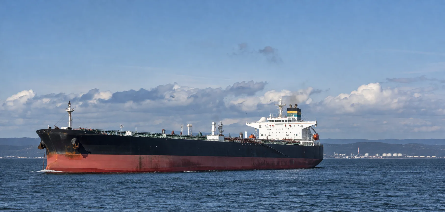 Oil tanker shipping vessel in Persian Gulf with crude oil price chart