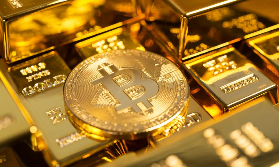 Gold bars next to falling Bitcoin cryptocurrency ticker screen and 4K financial charts