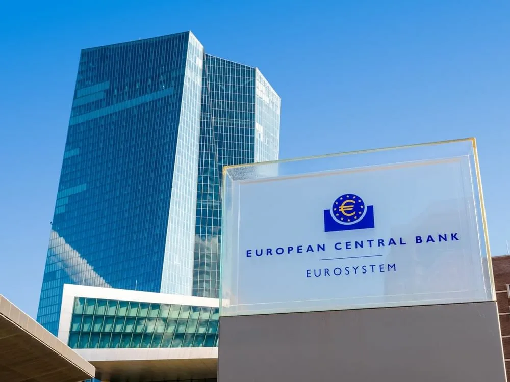 European Central Bank headquarters in Frankfurt with EUR USD currency trading chart