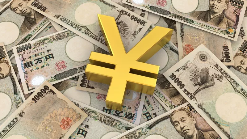 Gold bars and Japanese Yen USD JPY currency exchange rates trading concept