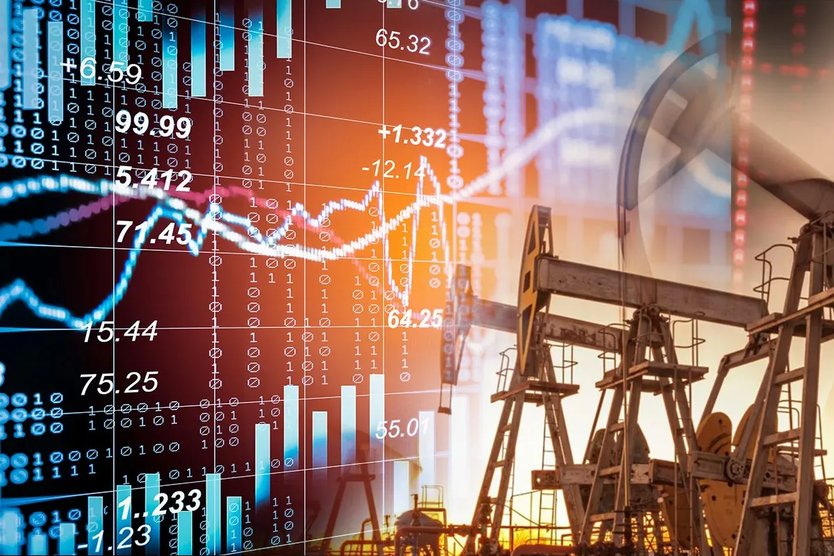 Oil tanker navigating narrow strait with Brent crude oil price chart trading above 100 dollars
