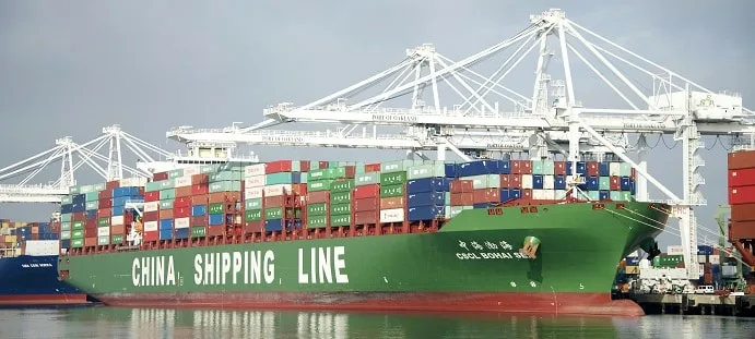 Asia Pacific financial hub skyline with cargo container ship representing trade export boom