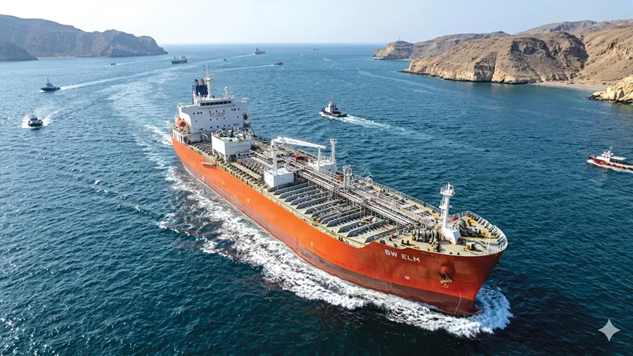 Oil tankers in Hormuz Strait near industrial refinery with rising oil price charts